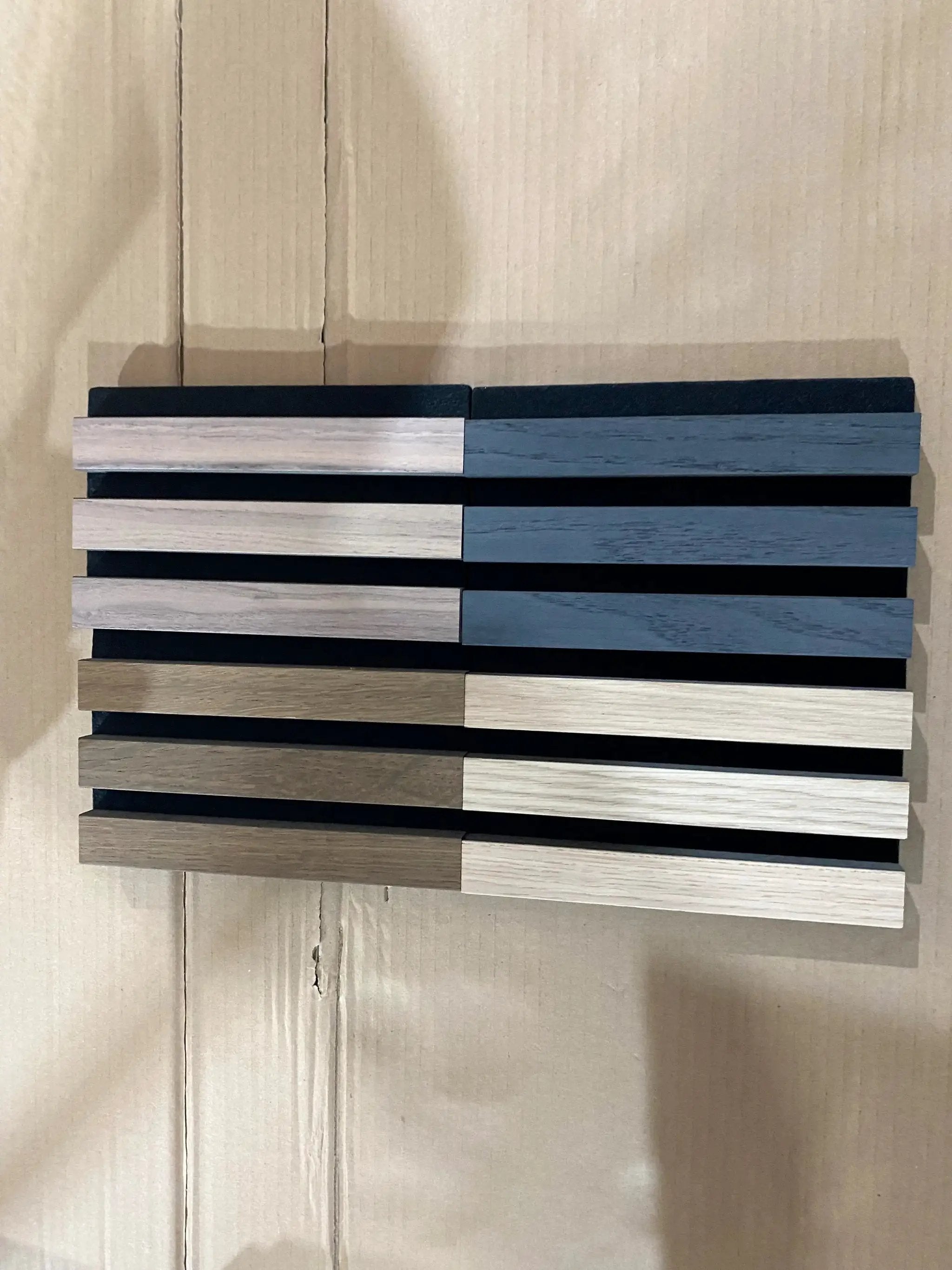 HAUSVITA MDF Wall Panel Sample Box with assorted wood-tone strip samples.