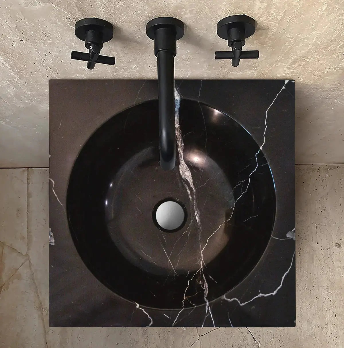 Natural Stone Marble pedestal sink, black with white Carrara veining on a square dark countertop