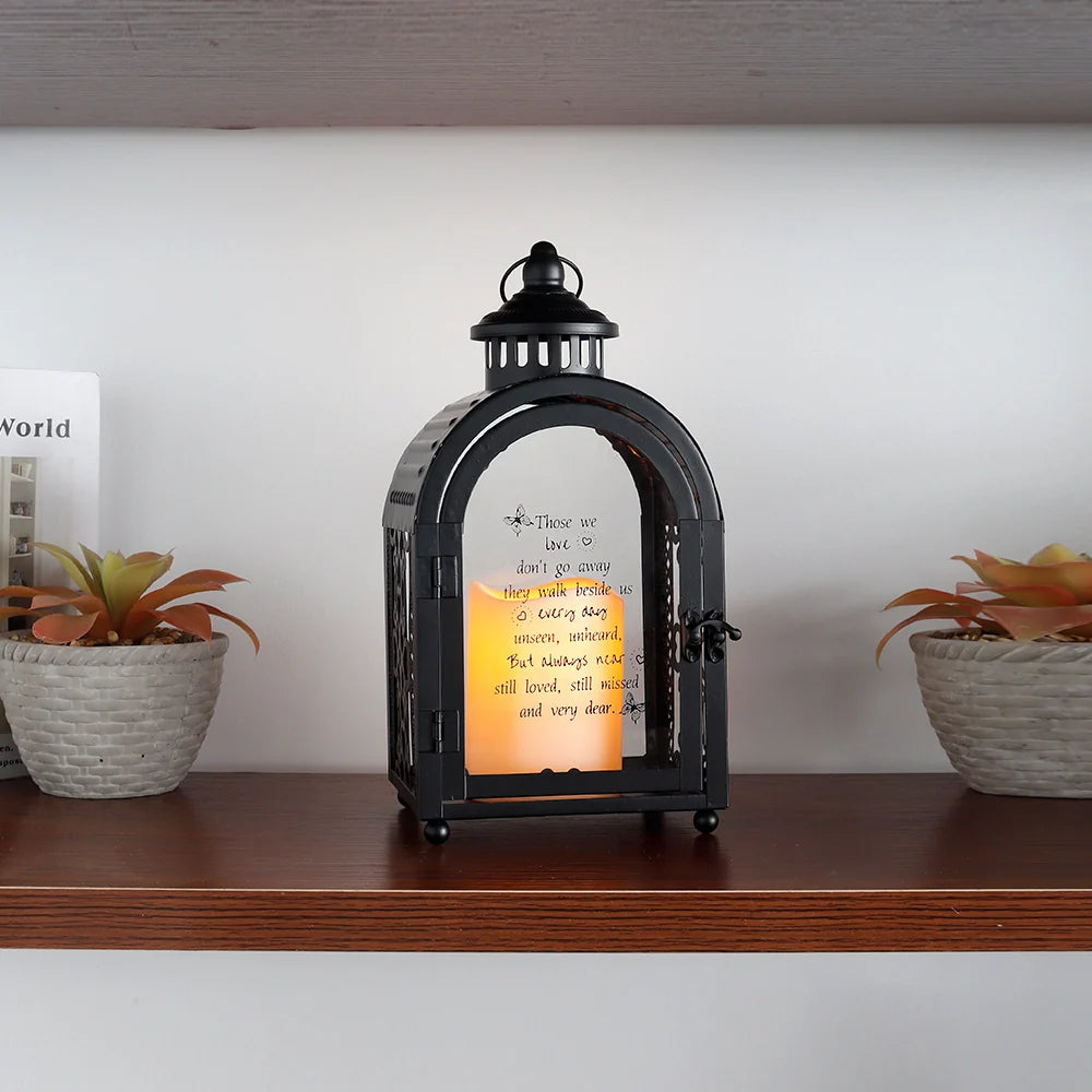 11-inch High Memorial Lantern in black, decorative candle lantern with a lit candle inside.