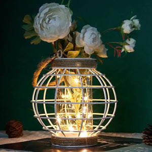 White metal cage LED lantern with warm string lights, battery-powered