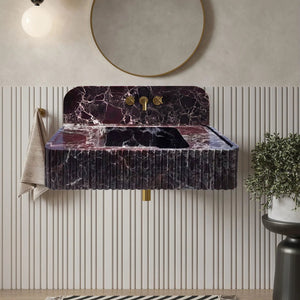 Rosso Levanto marble wall-mount bathroom sink with fluted front and dark purple veined surface