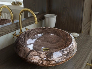 Narcist brown marble vessel sink with high-gloss finish and gold faucet