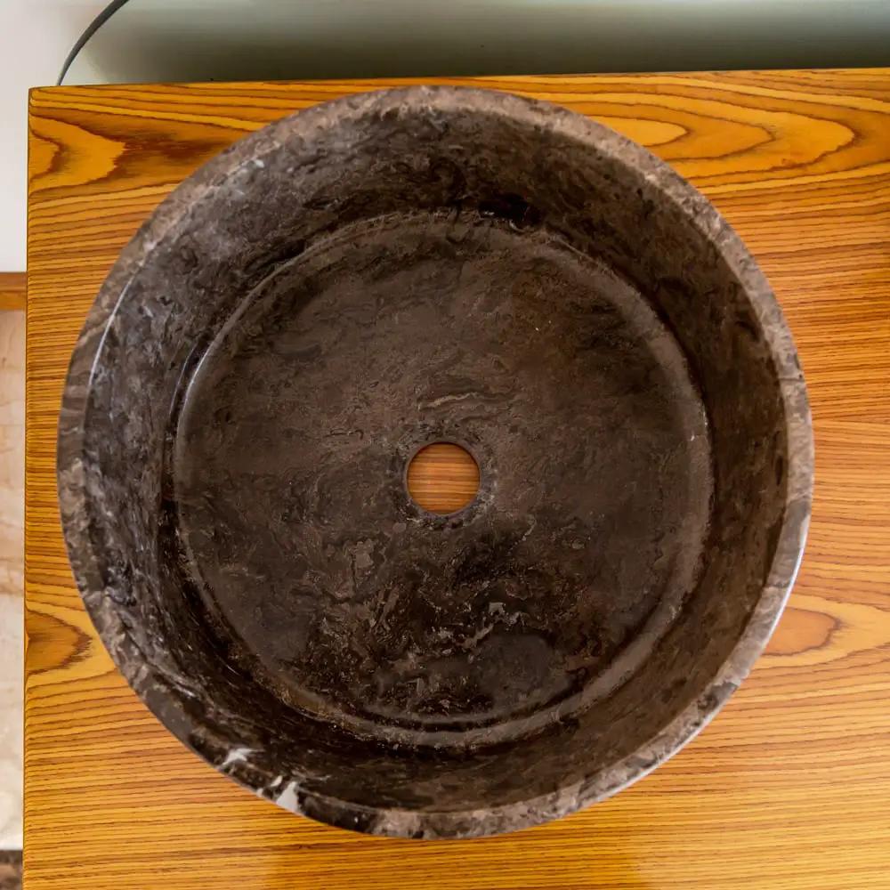 Narcist brown marble vessel sink by Villohome, round top-down view with central drain hole