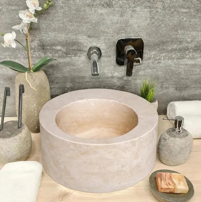 Travertine above-counter bathroom sink in light beige natural stone by Villohome