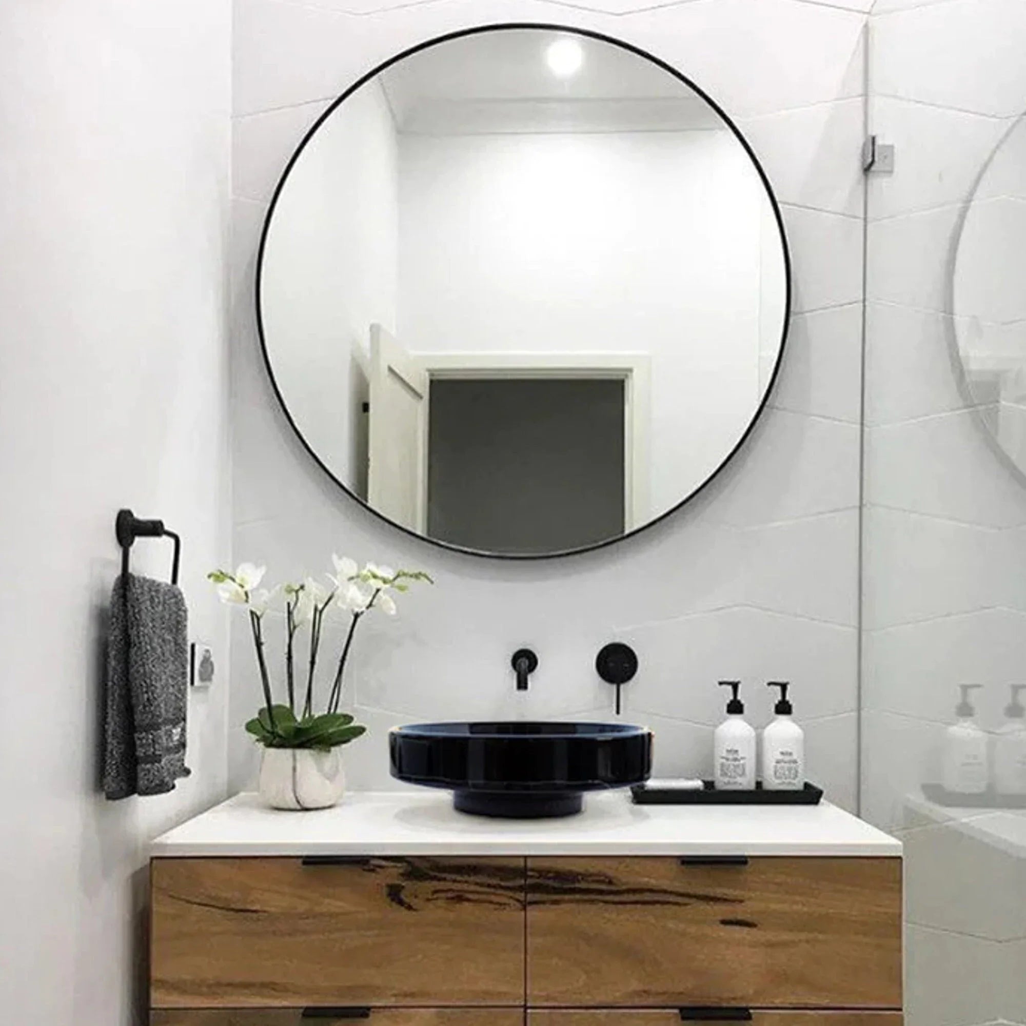 Toros black marble above-counter bathroom sink, round vessel with middle drain, 16 inch diameter on white vanity
