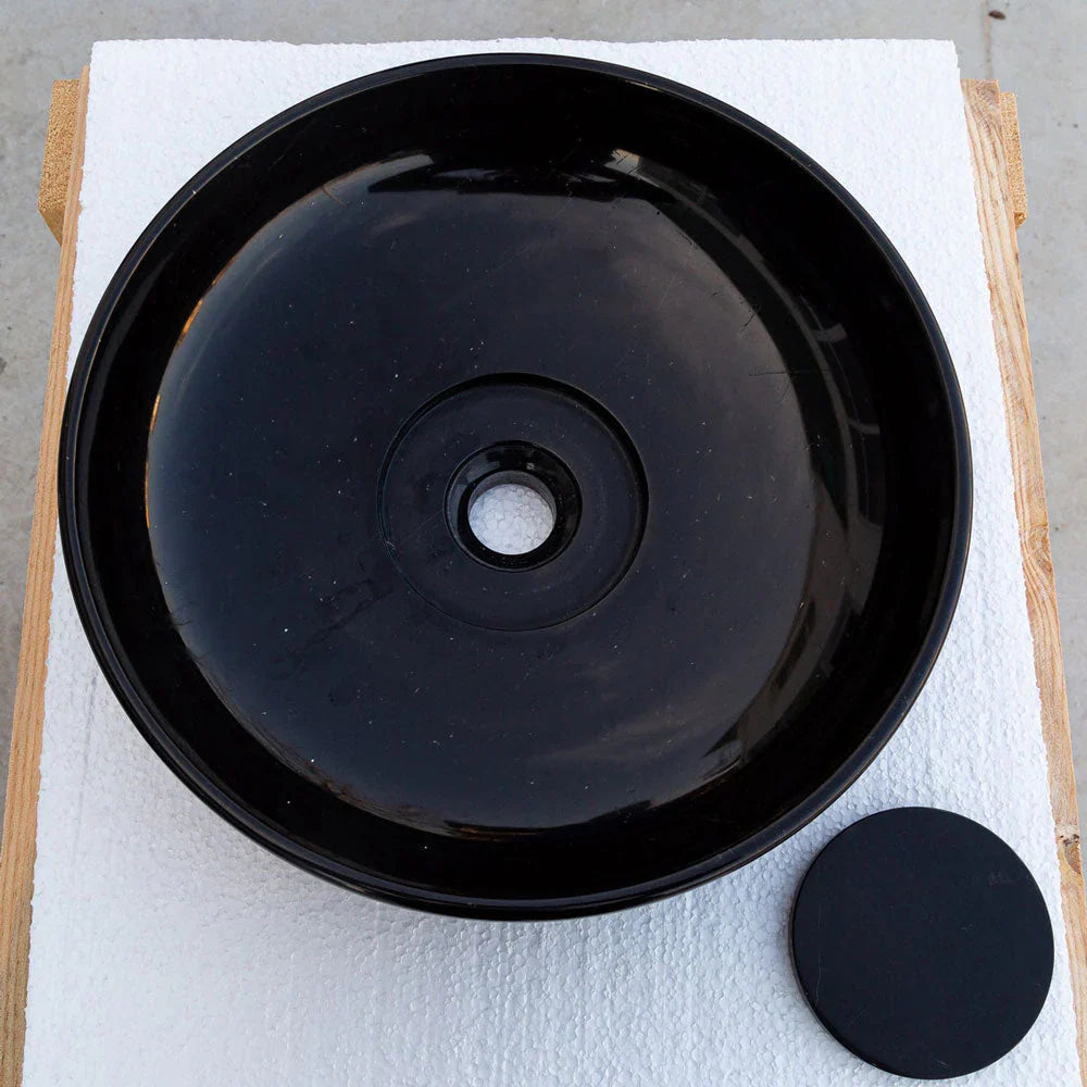 Toros black marble above-vanity bathroom sink, vessel-style with central drain; includes round drain cap.