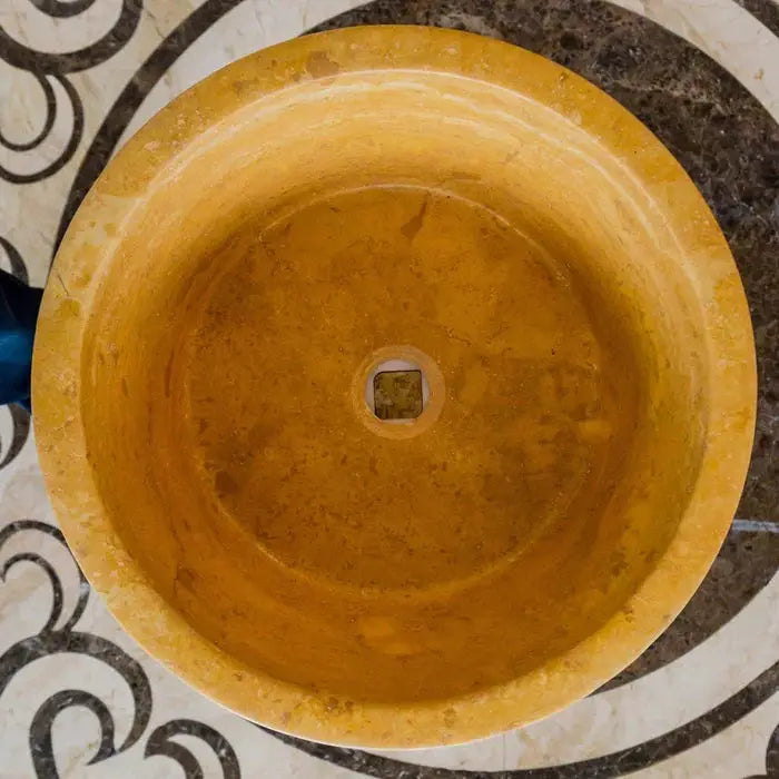 Villohome Oasis Gold travertine bathroom sink; round, honed finish with square drain hole.