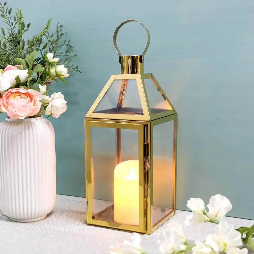 16 inch High Decorative Lantern by JHY DESIGN, rose-gold metal with glass panels and a lit candle