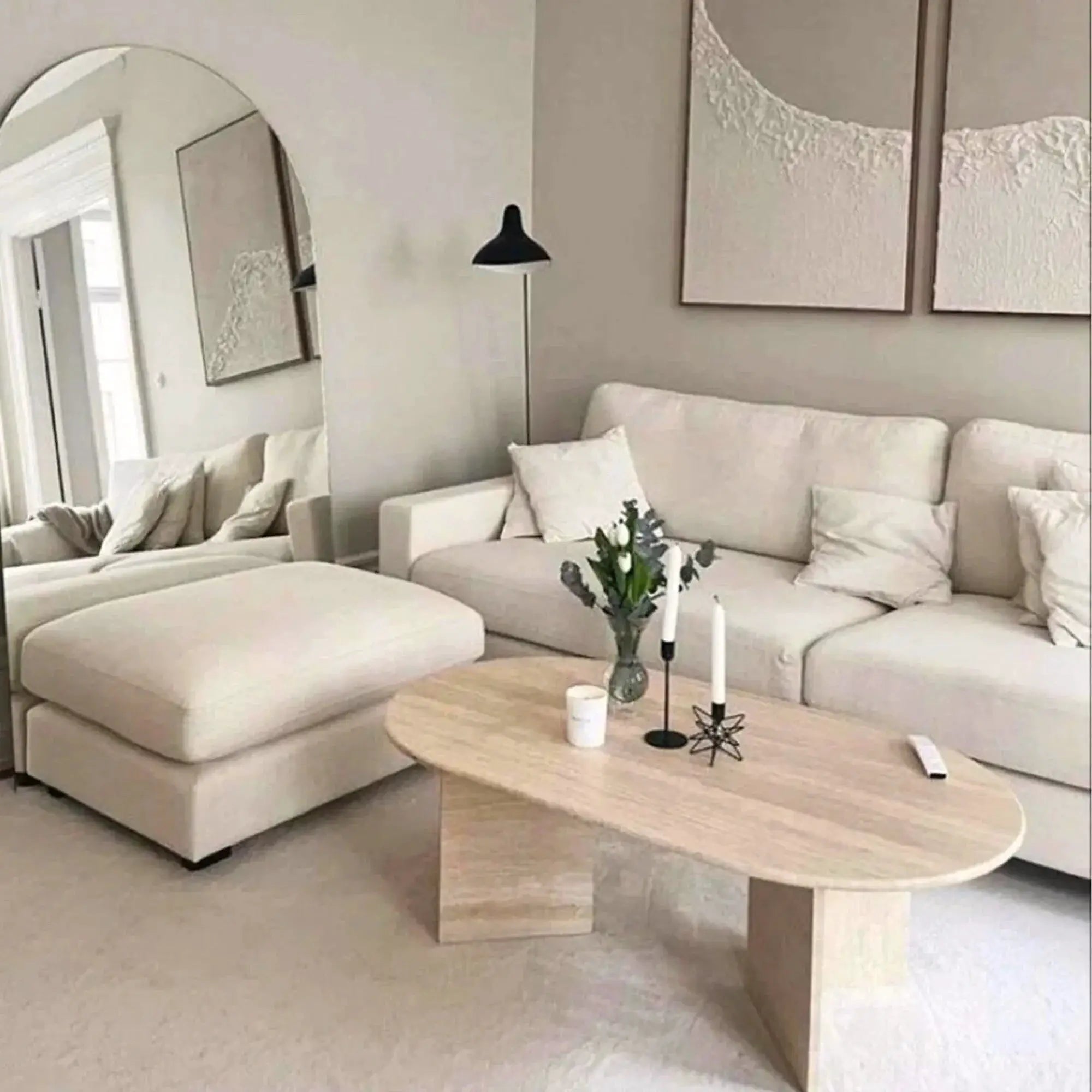 Troia Light Travertine oval coffee table; light stone finish in a neutral living room.