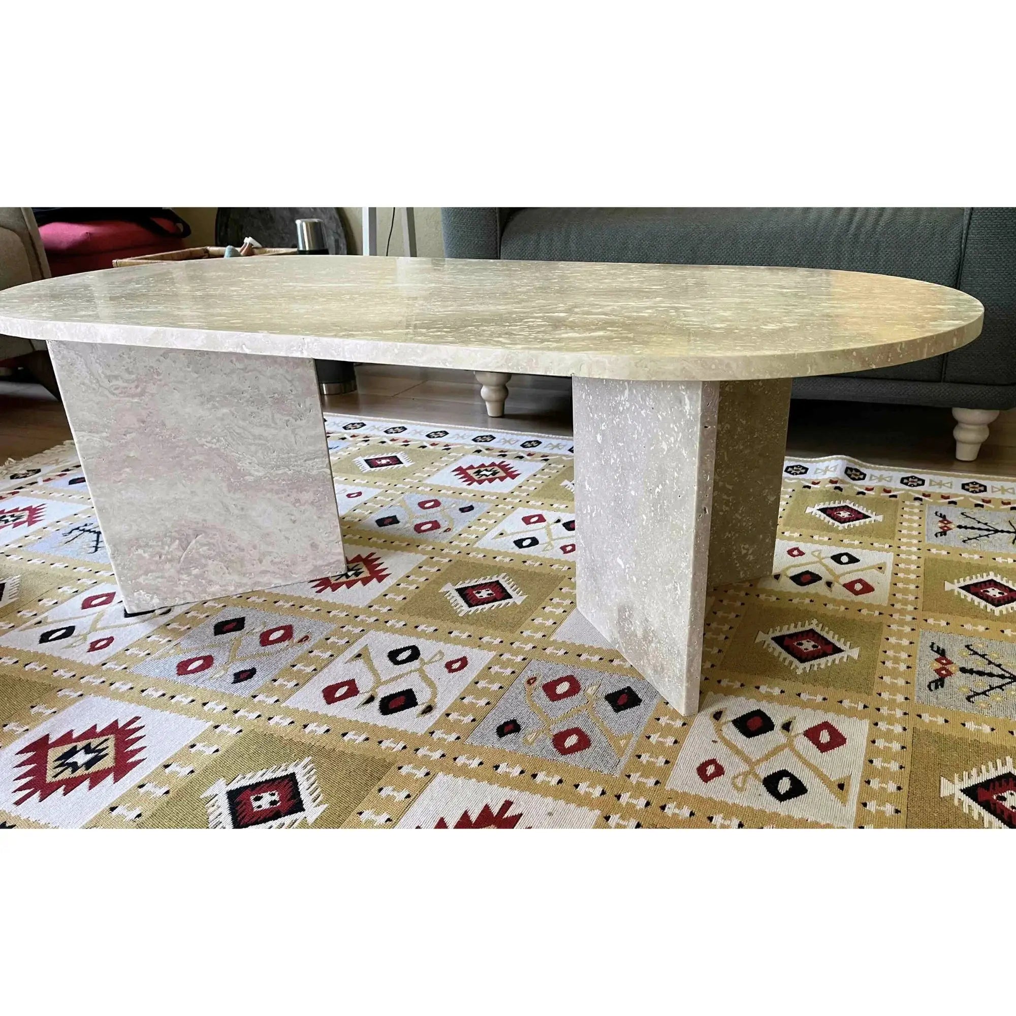 Troia Light Travertine oval coffee table; polished beige travertine, 48in long, 24in wide