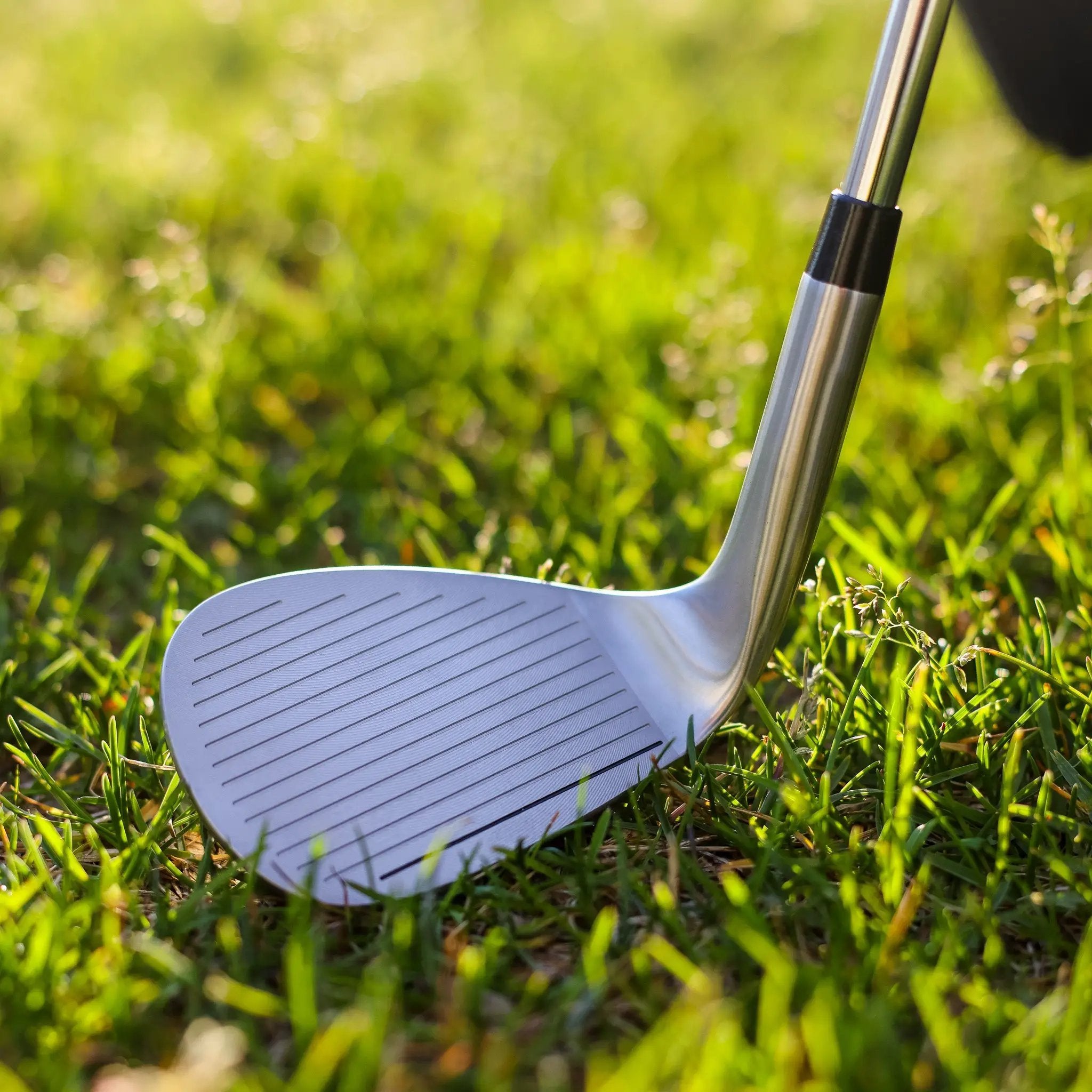 Ase Golf 3-Piece Wedge Set on grass; chrome wedge with grooved face.