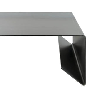 Rectangular metal coffee table with raw steel finish and angled leg