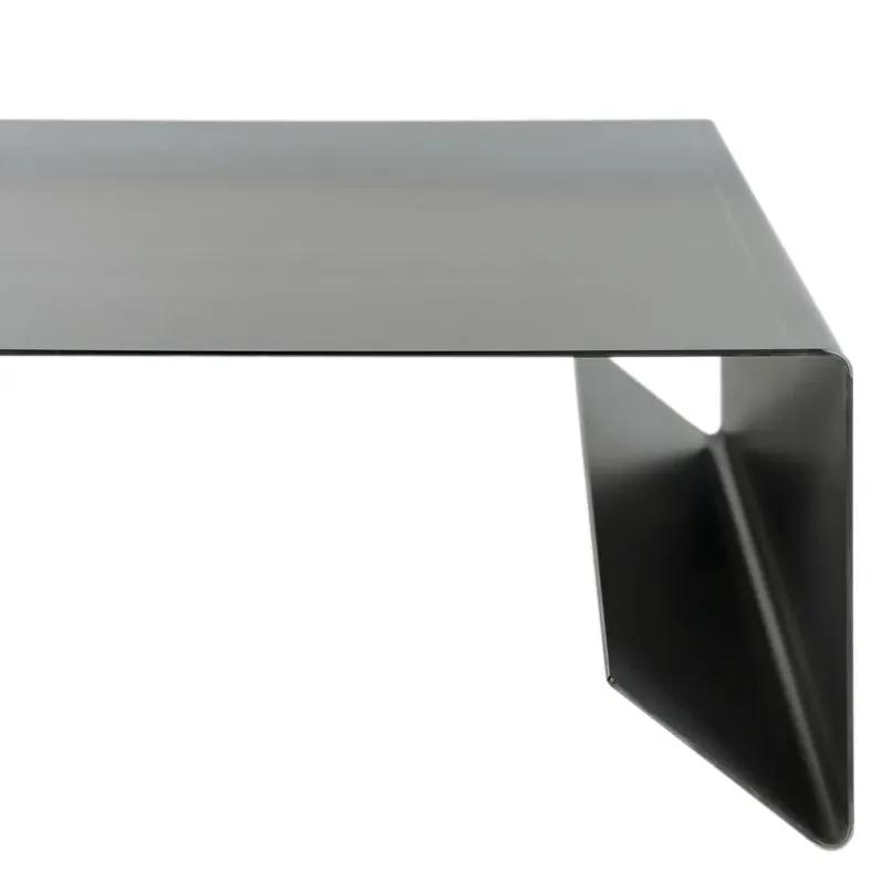Rectangular metal coffee table with raw steel finish and angled leg
