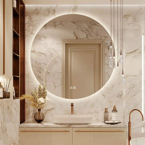 Round backlit LED HAUSVITA bathroom vanity mirror with dimmable lights in a marble bathroom.