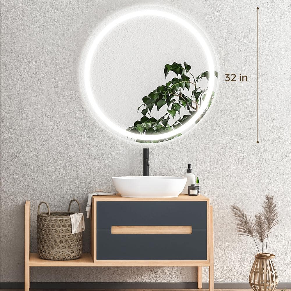 HAUSVITA round LED bathroom vanity mirror, 32 in, with dimmable lights above a wood vanity.
