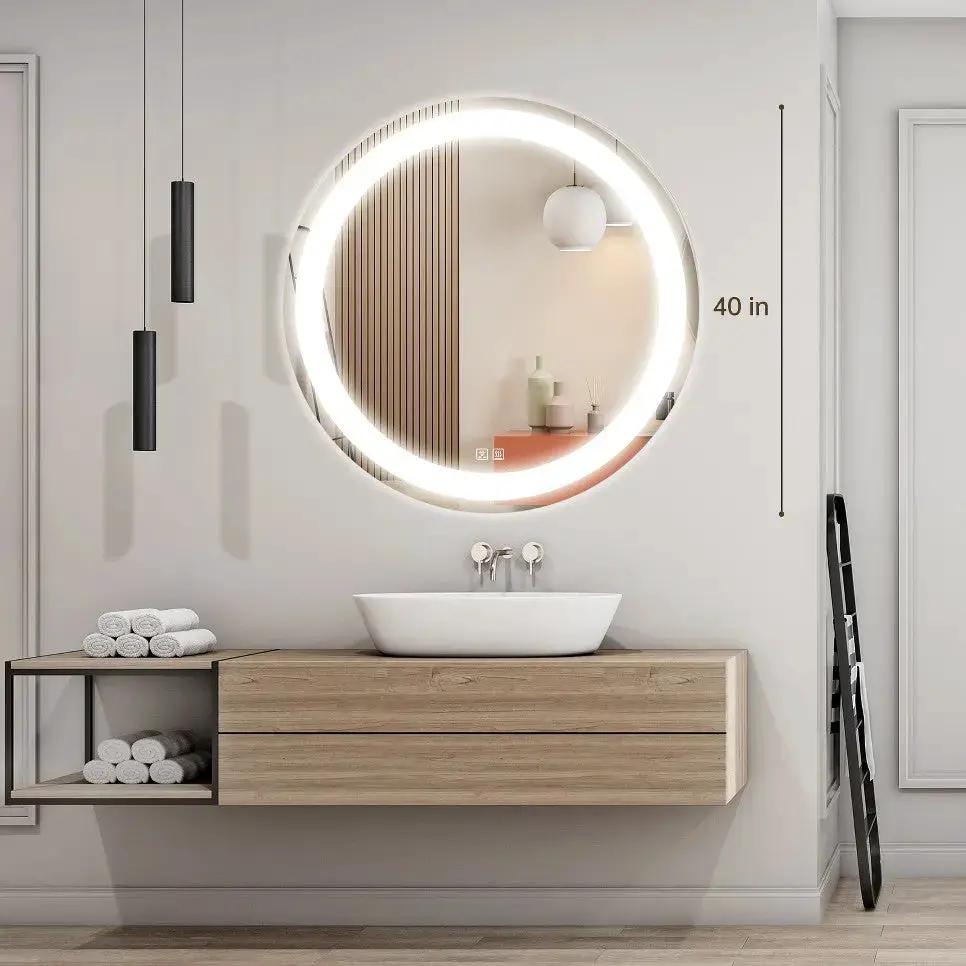 Round LED bathroom vanity mirror by HAUSVITA with dimmable lights, 40 in diameter above a wooden vanity.
