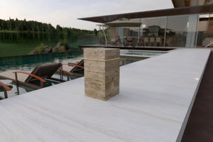 Beige travertine marble cube side table with LED glow; freestanding outdoor accent
