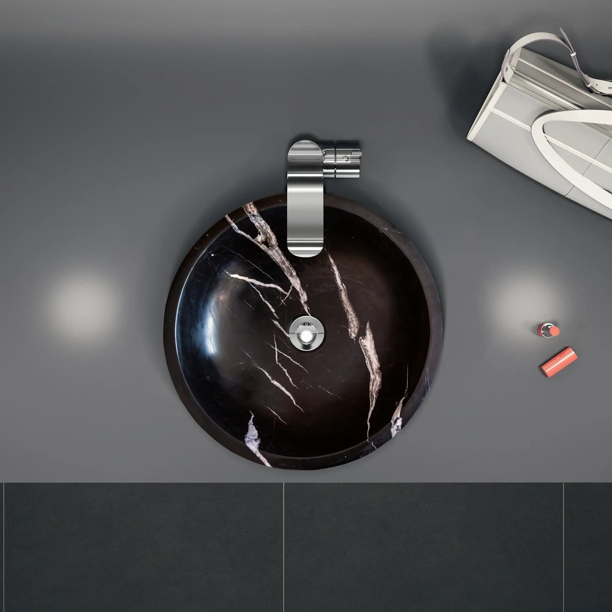 Natural Stone Toros Black Marble bathroom vessel sink above vanity, 16-inch diameter with chrome faucet.