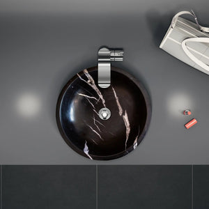 Natural Stone Toros Black Marble bathroom vessel sink above vanity, 16-inch diameter with chrome faucet.