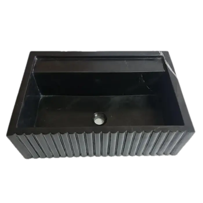 Toros black marble rectangular wall-mount sink with fluted exterior and interior basin with drain hole.