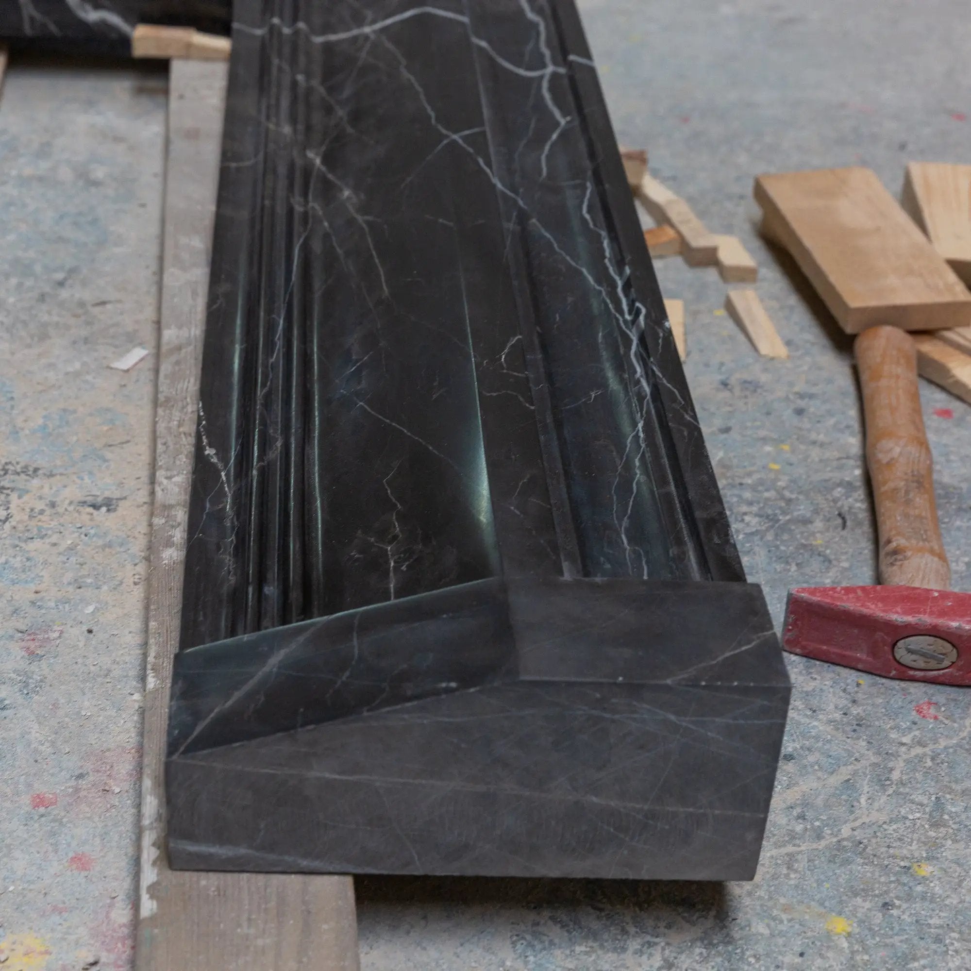 Toros Black Marble fireplace mantel by Villohome; hand-carved, polished black marble with white veining.