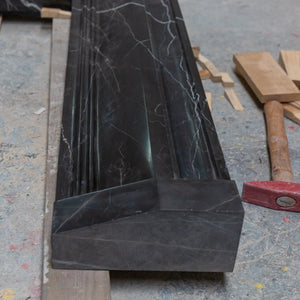 Toros Black Marble fireplace mantel by Villohome; hand-carved, polished black marble with white veining.