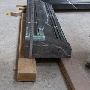 Toros Black Marble fireplace mantel slabs by Villohome; polished, hand-carved marble on pallets