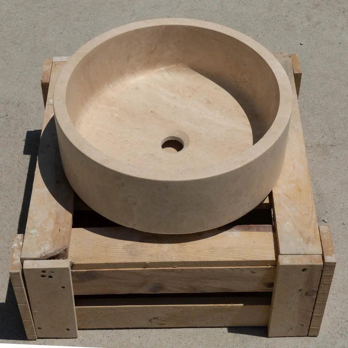 Troia Light Travertine round vanity sink by Villohome; honed beige stone, 16 in diameter, 6 in high.