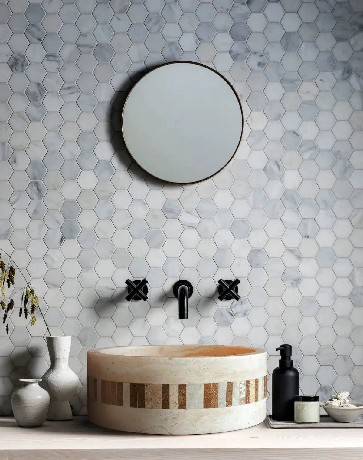 Troia Light travertine cylindrical above-vanity bathroom sink with 2-inch embedded mosaic border.