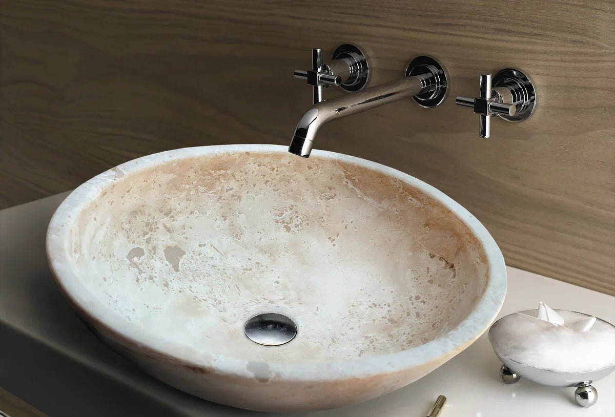 Troia Light Travertine oval vessel sink for above-vanity bathroom with chrome wall faucet by Villohome