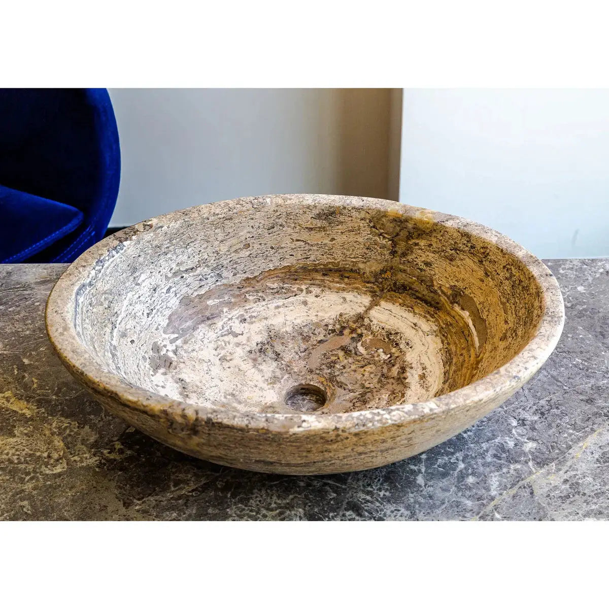 Valencia Travertine natural stone oval above-vanity vessel sink; beige with swirled veining, 16x21x6 inches