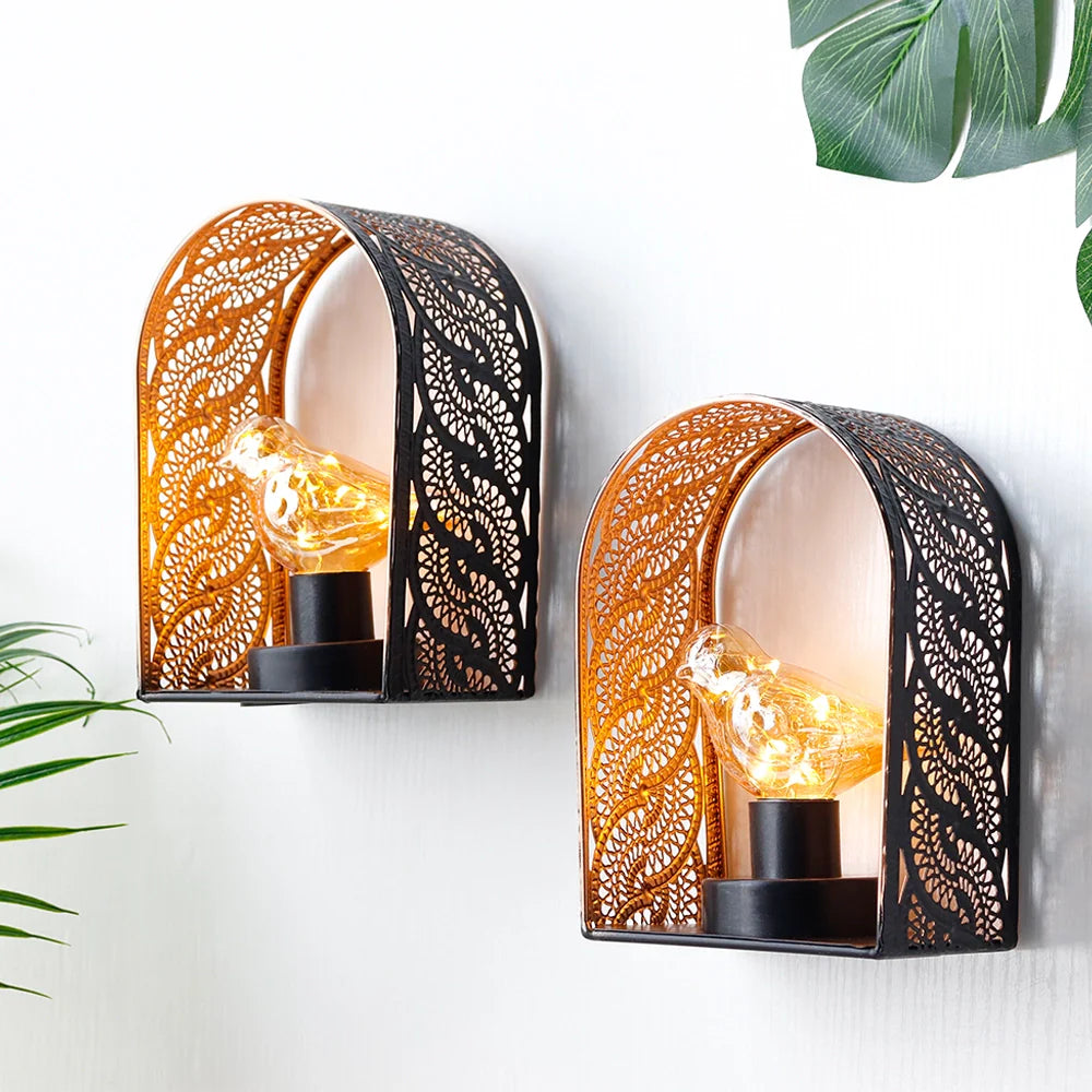 Set of 2 bird-bulb wall sconces with lace-pattern metal cages and warm Edison bulbs