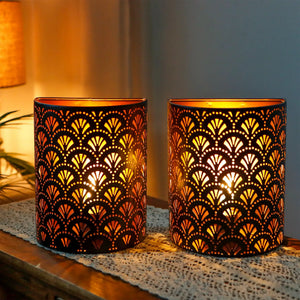 Set of 2 battery-operated wall sconces, JHY DESIGN Flabellum, black metal with decorative cutout pattern and warm amber glow.