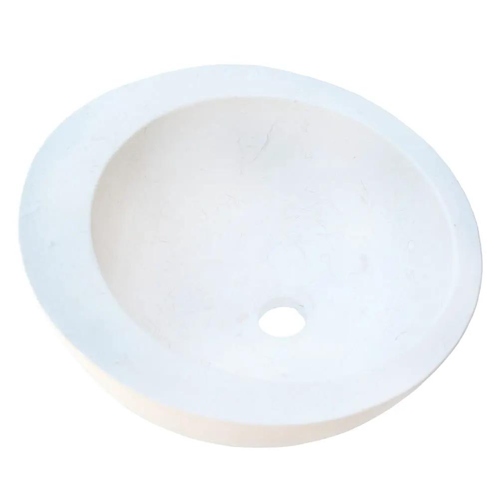 Vanity sink, white limestone circular basin with sloped rim.