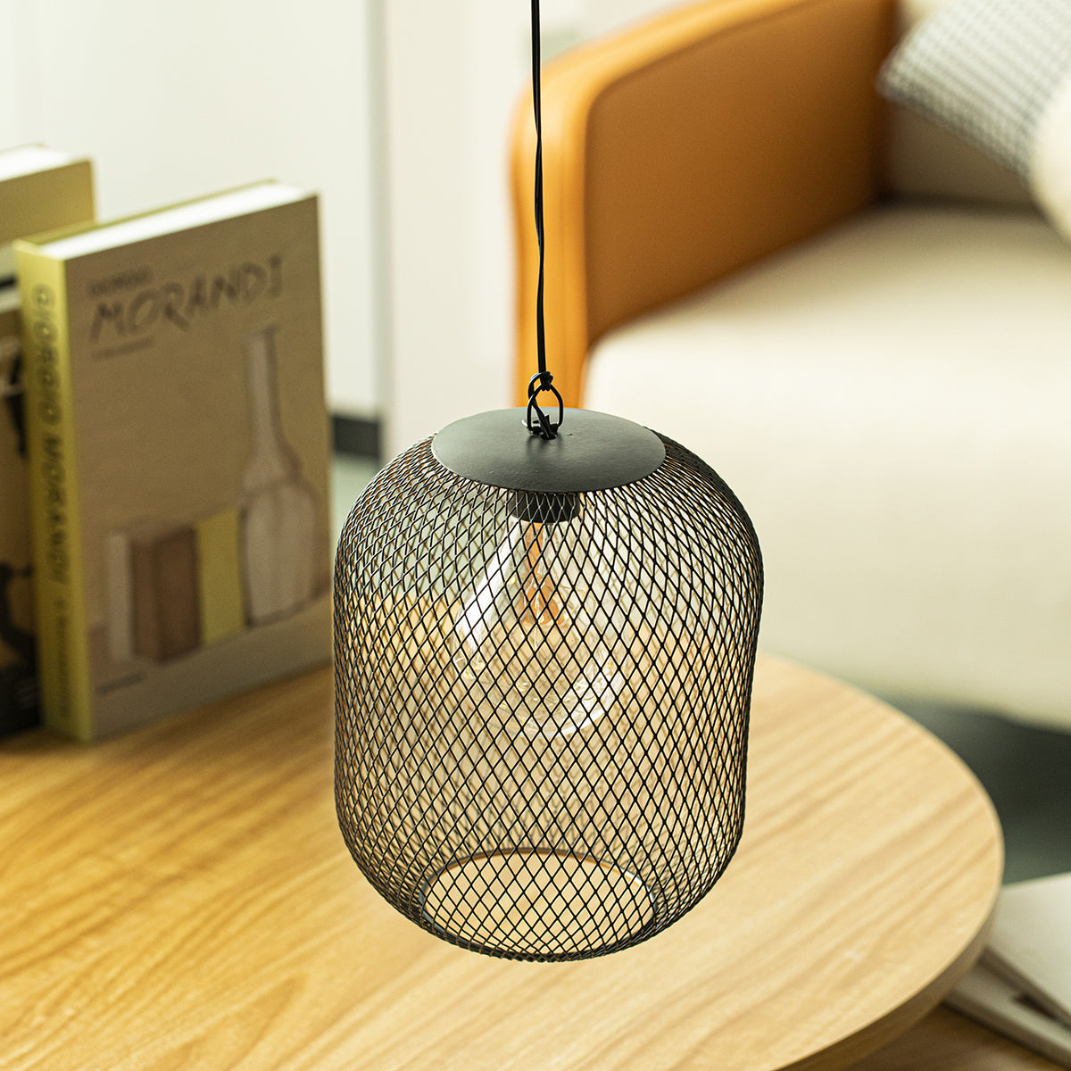 8.5in battery-operated hanging mesh lantern in black metal with exposed bulb