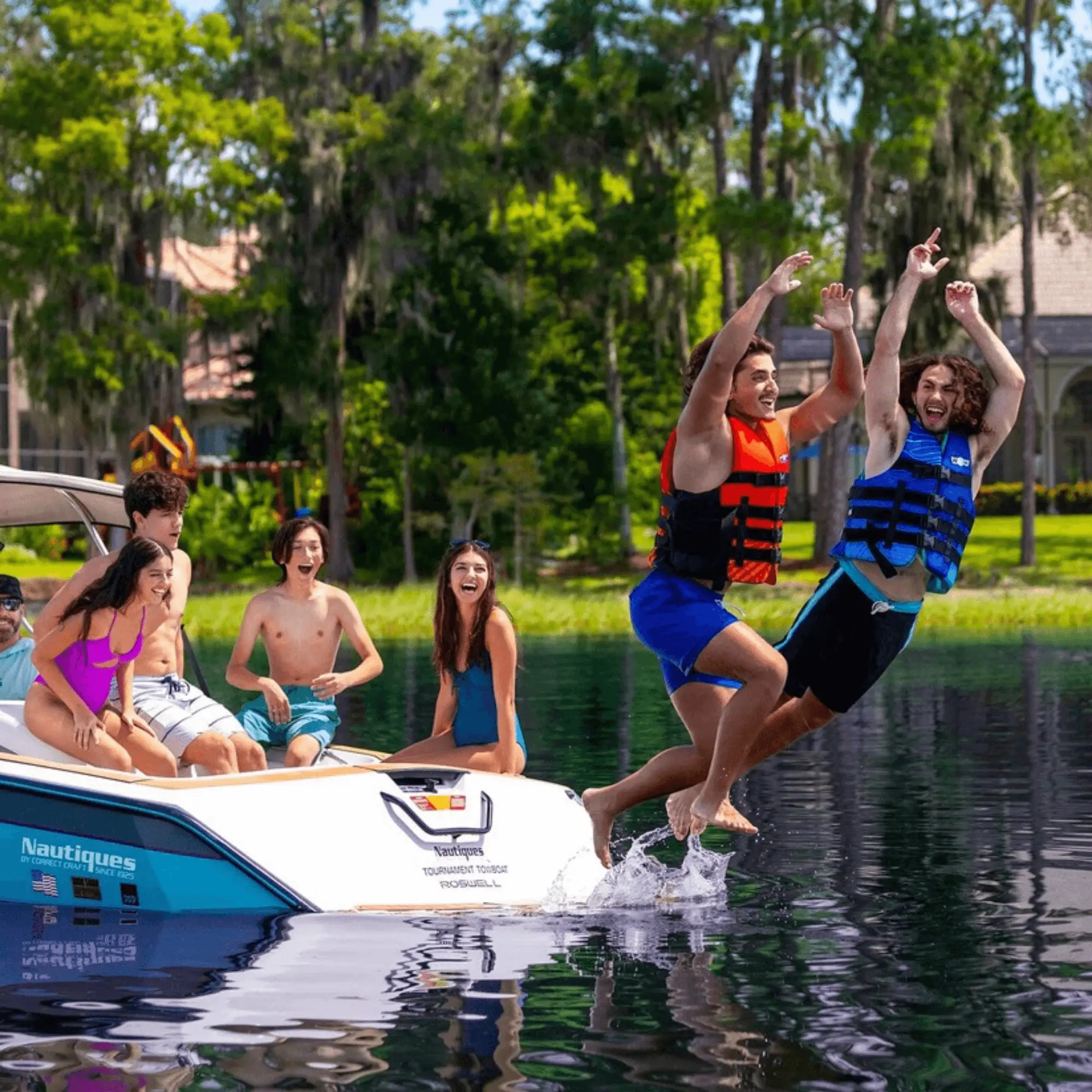 WOW Watersports Vis-Wave blue adult life vest worn by group on a boat.