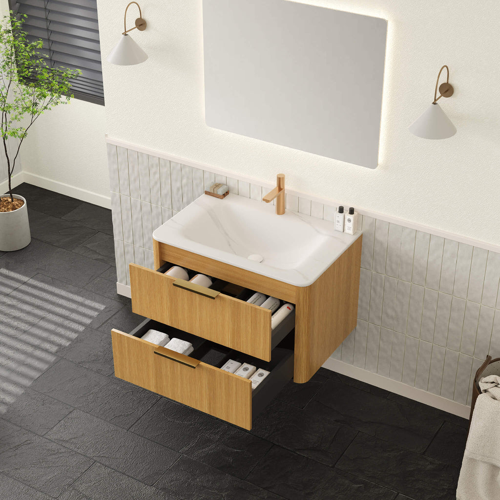 Bathroom vanity with wooden cabinets, white sink, and mirror in a modern bathroom setting.
