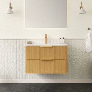 Bathroom vanity with wooden cabinet, white countertop, and mirror above in a tiled bathroom.