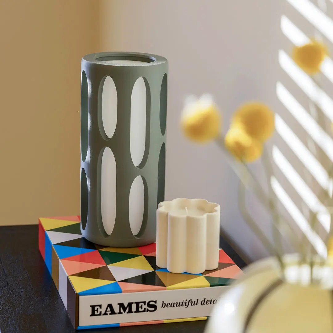 Amoeba table lamp; green cylindrical design with tall oval cutouts.