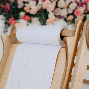 Art Addition to the Triangle Ladder Goodevas wooden ladder accessory with white paper roll.