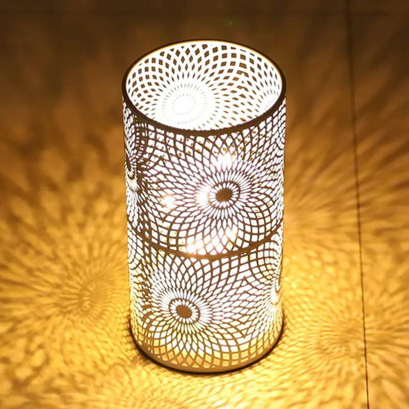 Battery-powered table lamp set of 2 by JHY DESIGN; cylindrical metal lamp with intricate circular floral lattice, warm glow.