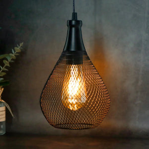 Battery operated hanging lamp with a black metal mesh shade and warm amber glow.