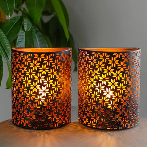 Set of 2 JHY DESIGN snowflake wall sconce lamps, metal with orange glow, battery operated.
