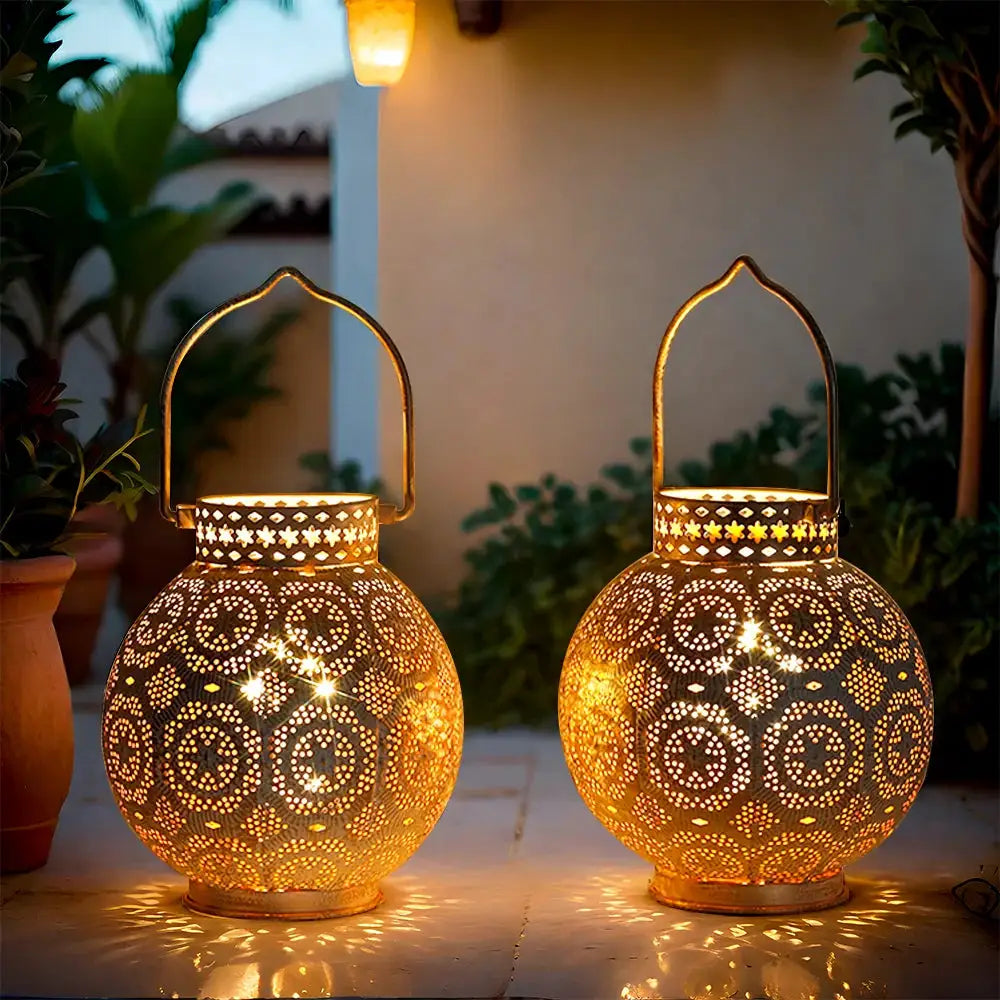 Set of 2 7-inch Moroccan lanterns, battery-operated, with intricate perforated metal pattern and warm glow.