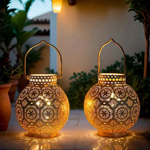 Set of 2 7-inch Moroccan lanterns, battery-operated, with intricate perforated metal pattern and warm glow.