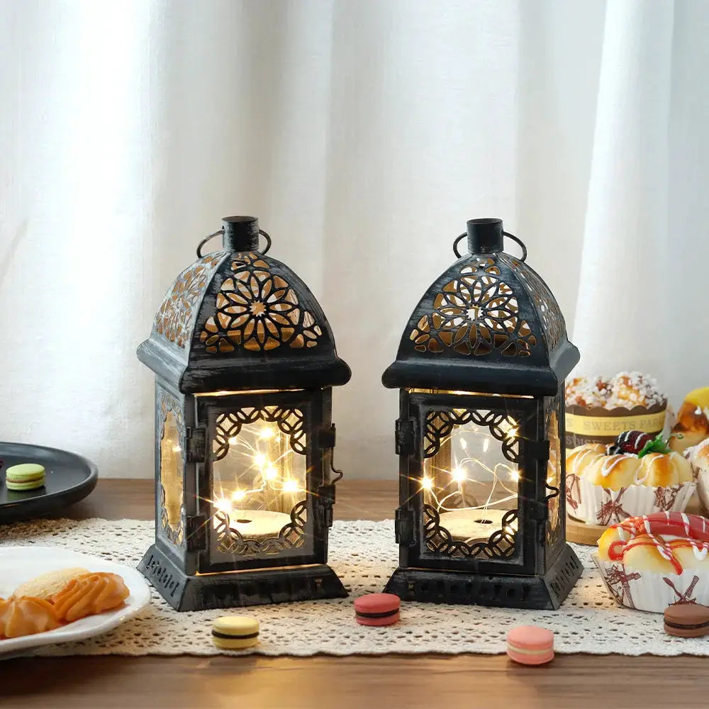 Set of 2 8-in grey metal battery-operated lanterns with vintage floral cutouts by JHY DESIGN.