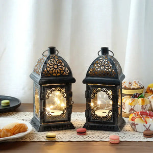 Set of 2 8-in grey metal battery-operated lanterns with vintage floral cutouts by JHY DESIGN.