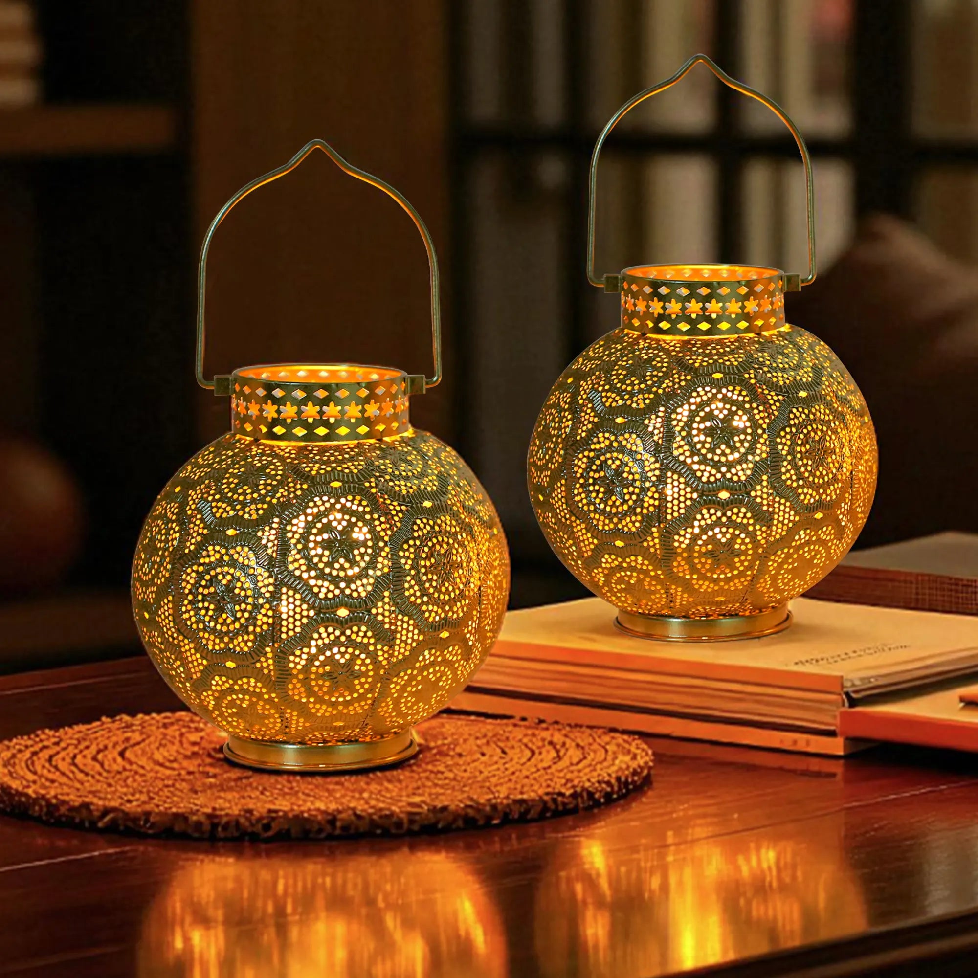 Set of 2 Moroccan-style metal table lamps with brass-tone finish and warm amber glow, battery-operated