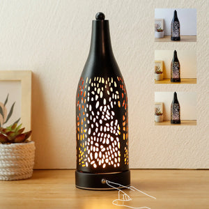 Cordless table lamp with black perforated metal body and warm glow, 4000mAh rechargeable battery