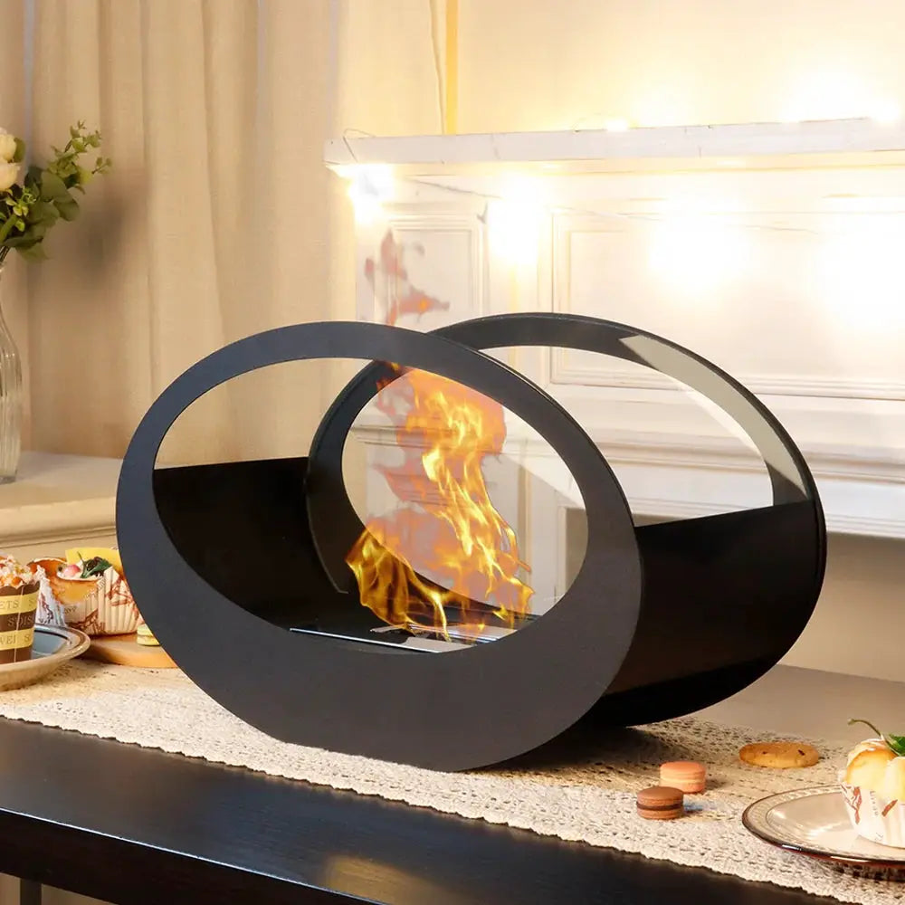 16x9.5in black metal tabletop fireplace with circular ring design for gel/ethanol flames.